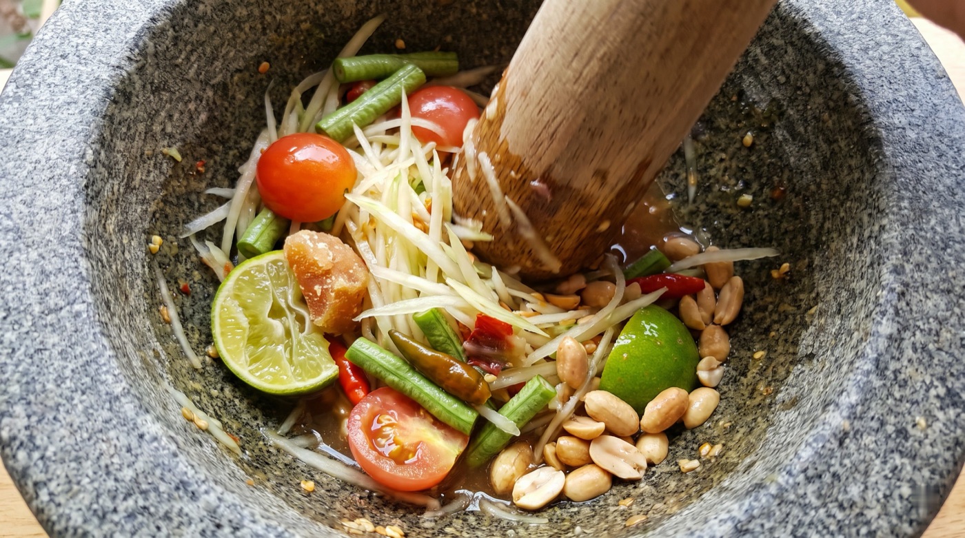 Som tam pounded in a mortar